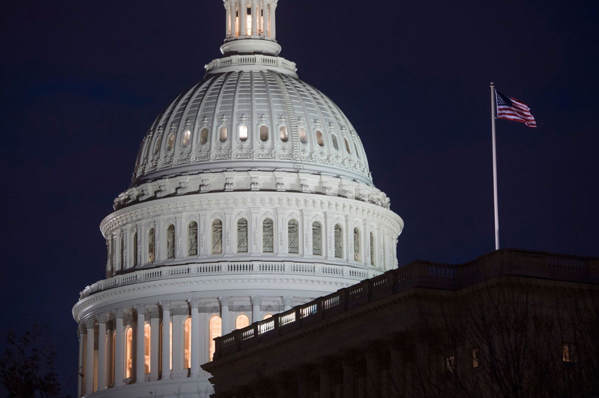 <i>SAUL LOEB/Getty Images</i><br/>The US Capitol Building is seen at dusk in Washington in February 2018. House Democratic leadership will announce legislation in August banning lawmakers from trading stocks.
