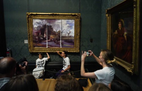 Just Stop Oil climate activists in London subvert "The Hay Wain" painting by John Constable and glue themselves to the frame at the National Gallery on July 4.