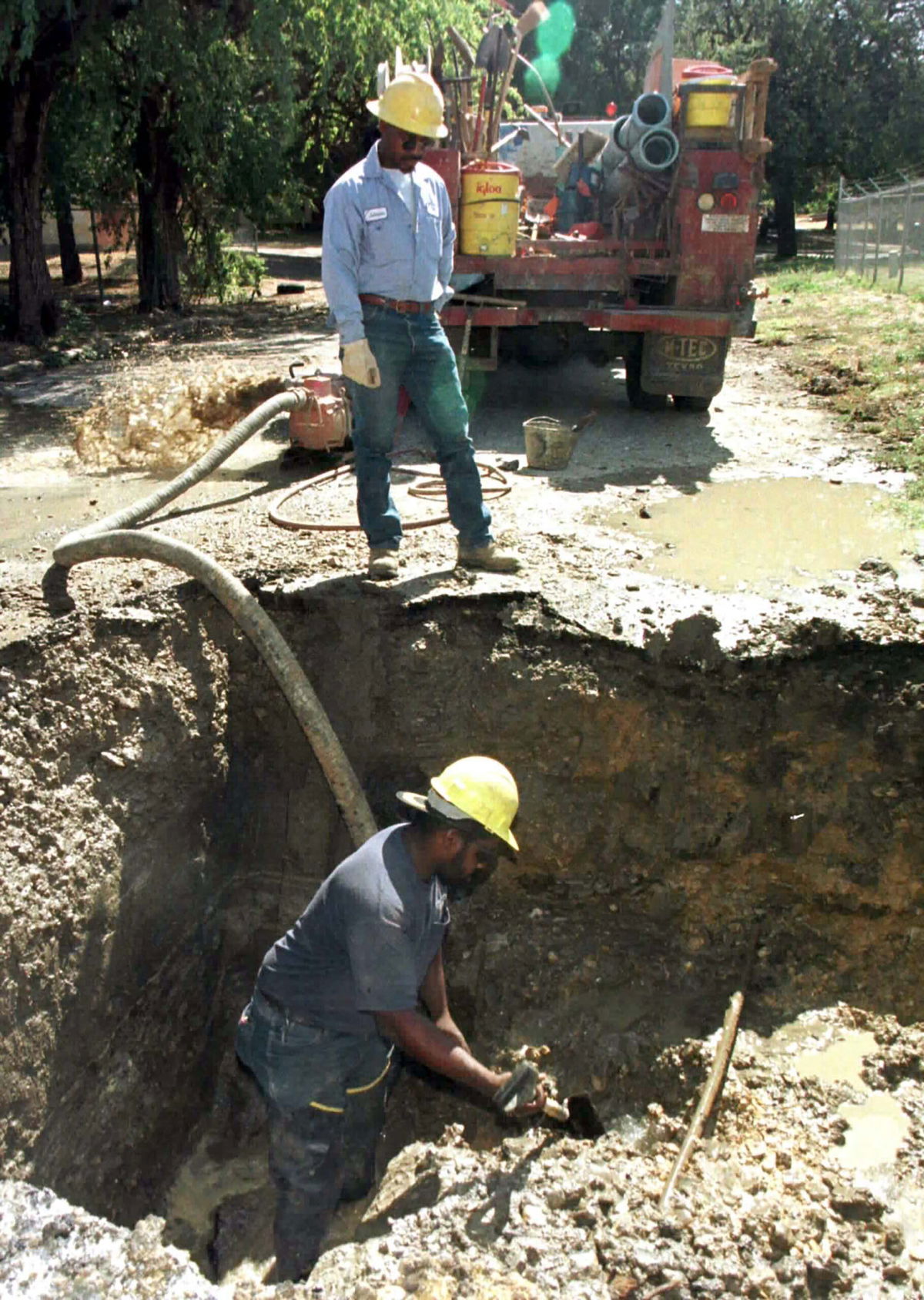 <i>Str Old/Reuters</i><br/>A construction worker digs out a hole around a broken 20-inch water main in Fort Worth