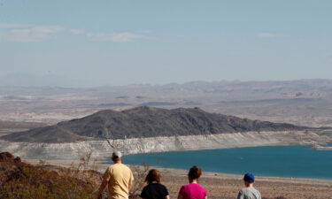 People look out at Lake Mead from the Overlook at Hoover Dam Lodge in Boulder City