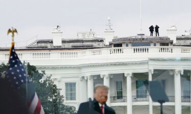 Members of the Secret Service patrol from the roof of the White House on January 6