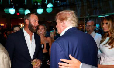 Former US President Donald Trump talks with Dustin Johnson during the welcome party for the LIV Golf event at Bedminster. Trump will play a round with Johnson and Bryson DeChambeau ahead of the LIV Golf event which begins July 29.