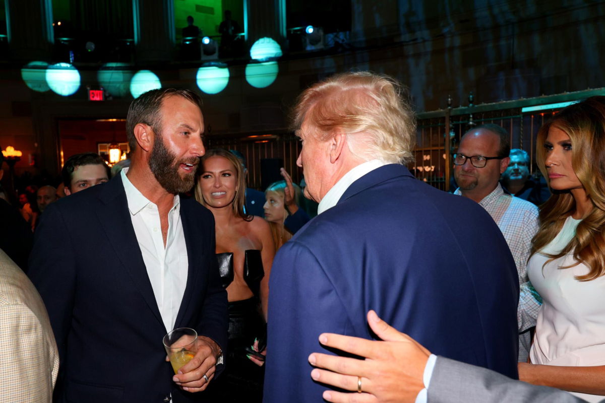<i>Chris Trotman/LIV Golf/Getty Images</i><br/>Former US President Donald Trump talks with Dustin Johnson during the welcome party for the LIV Golf event at Bedminster. Trump will play a round with Johnson and Bryson DeChambeau ahead of the LIV Golf event which begins July 29.