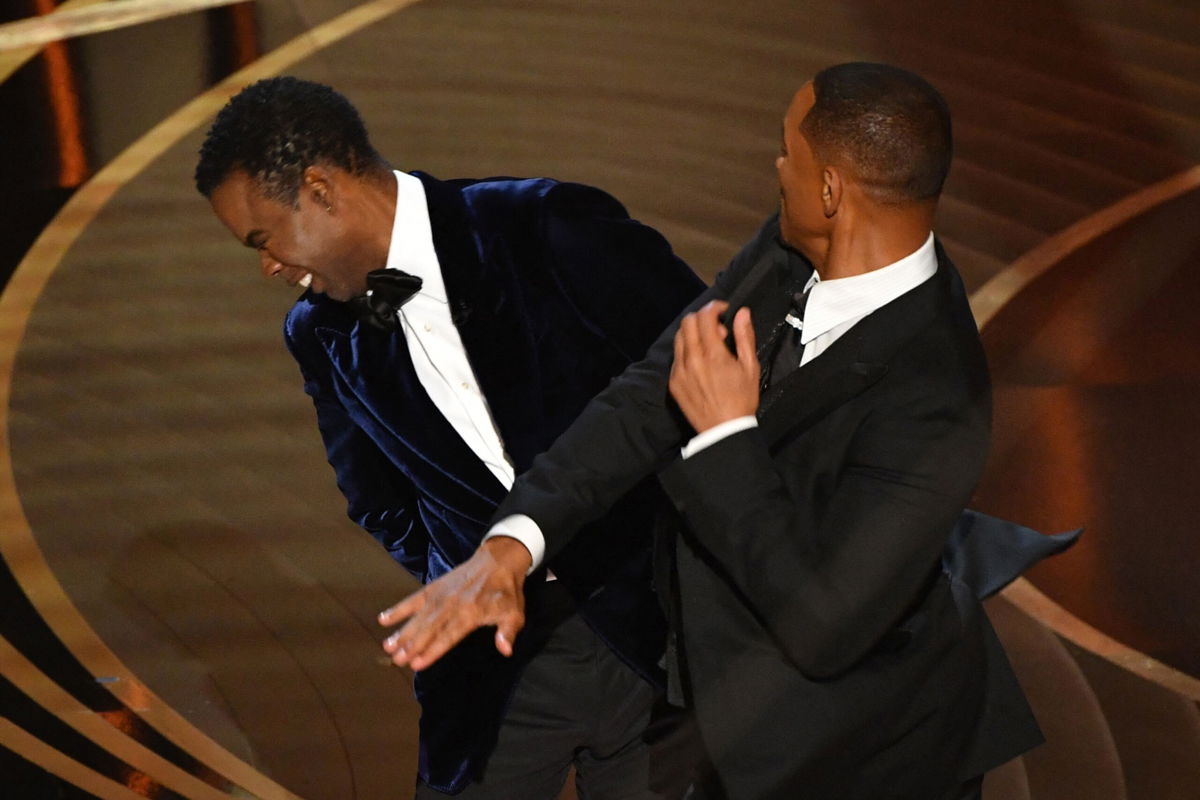 <i>Robyn Beck/AFP/Getty Images</i><br/>Will Smith and Chris Rock on stage at the Oscars.