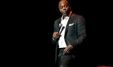 Dave Chappelle speaks onstage at the Duke Ellington School of the Arts on June 20 in Washington