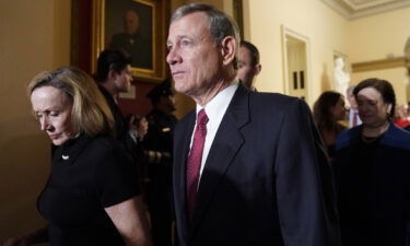 U.S. Supreme Court Chief Justice John Roberts departs with his wife Jane after U.S. President Donald Trump concluded his second State of the Union address to a joint session of the U.S. Congress in the House Chamber of the U.S. Capitol in Washington