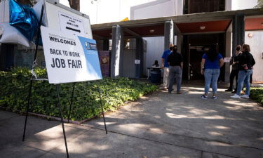 A sign reads 'Back to Work Job Fair' at the entrance of the Southern California Goodwill in Los Angeles