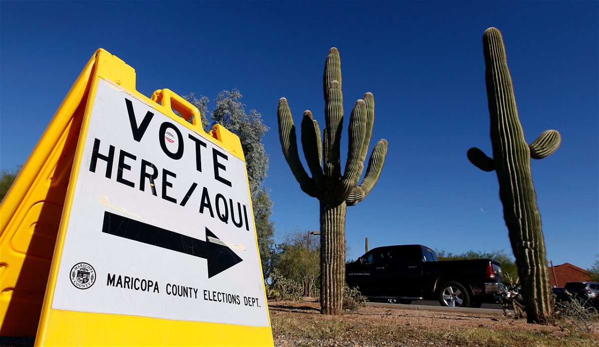 <i>Ralph Freso/Getty Images</i><br/>A Maricopa County Elections Department sign directs voters to a polling station on November 8