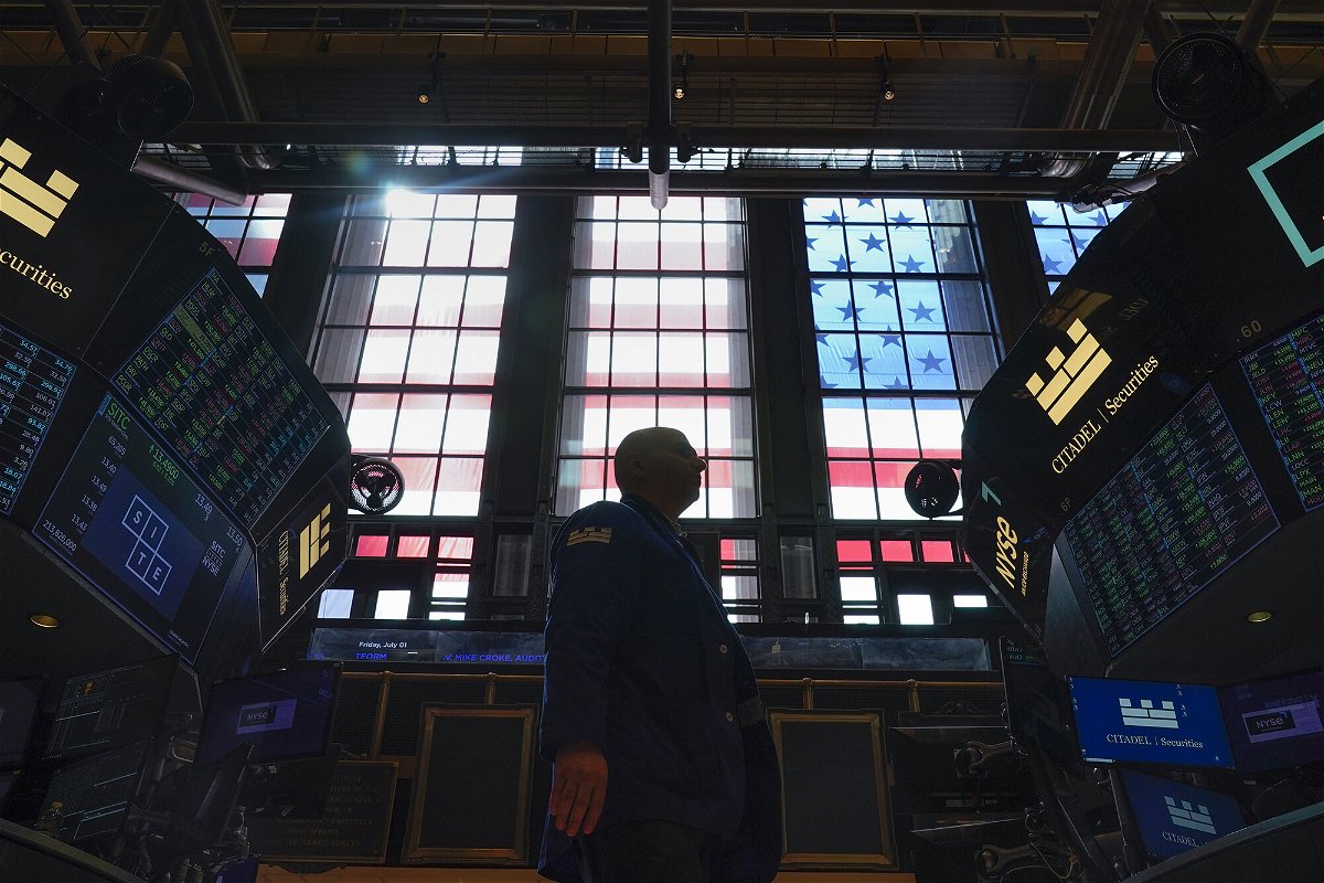 <i>Seth Wenig/AP</i><br/>Traders work on the floor at the New York Stock Exchange in New York