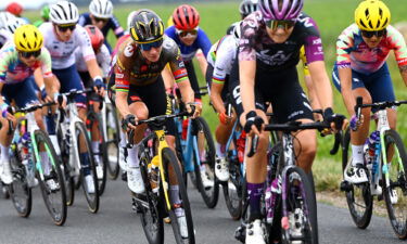 The women's peloton racing in the Tour de France Femmes.