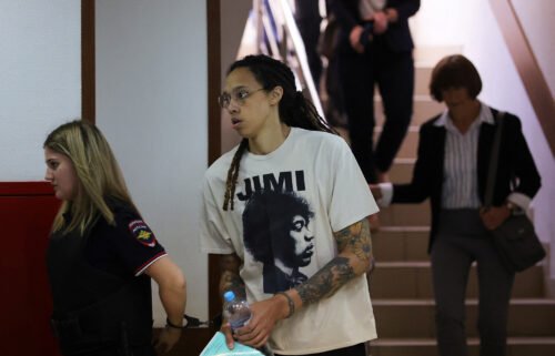 WNBA player Brittney Griner is escorted before a court hearing in Khimki outside Moscow on July 1