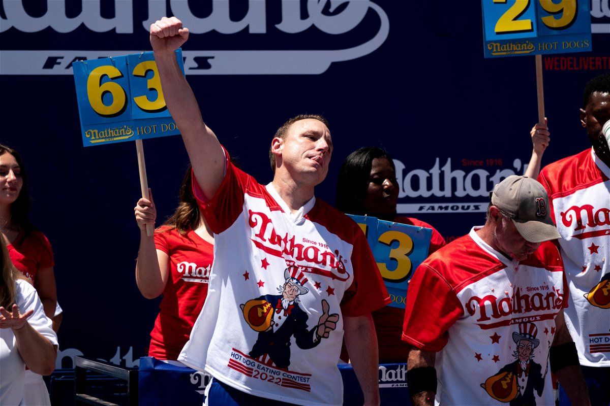 <i>Julia Nikhinson/AP</i><br/>Joey Chestnut reacts after scarfing more hot dogs than anyone else on July 4.