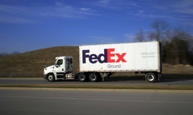 A FedEx Corp. Ground semi truck drives through Louisville