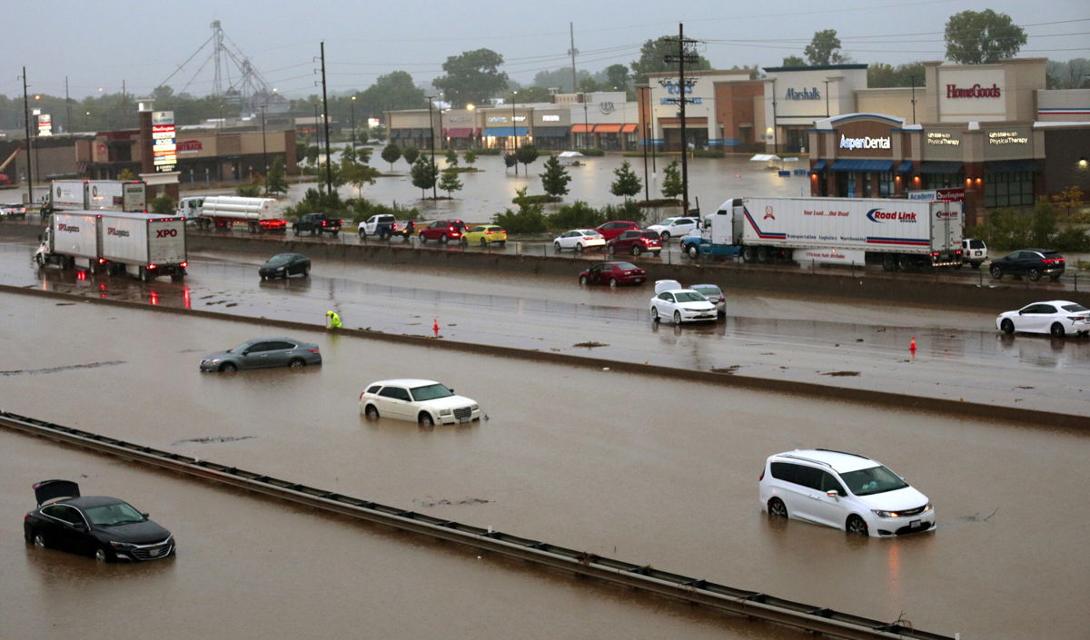 <i>Robert Cohen/St. Louis Post-Dispatch/AP</i><br/>Abandoned cars are scattered by flooding across a shuttered section of I-70 Tuesday.