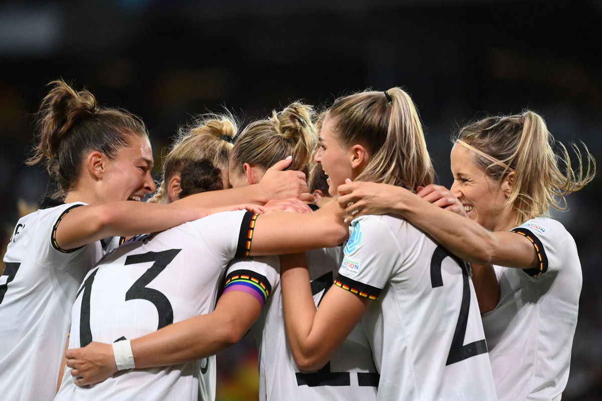 <i>FRANCK FIFE/AFP/AFP via Getty Images</i><br/>Germany's players celebrate Popp's opening goal of the match.