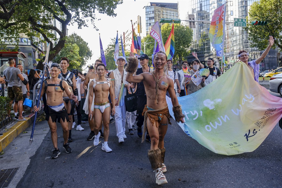 <i>Alberto Buzzola/LightRocket/Getty Images</i><br/>People take to the streets of Taipei during the city's annual Pride festival in 2020. The island has a progressive reputation in Asia