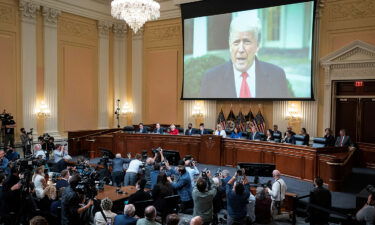 A video of former President Donald Trump is shown on a screen