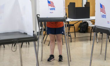 A voter casts their ballot at a polling place during the midterm primary election on July 19 in Baltimore