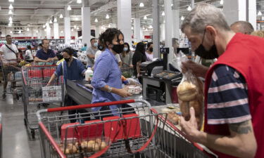 People shop at a supermarket on June 10