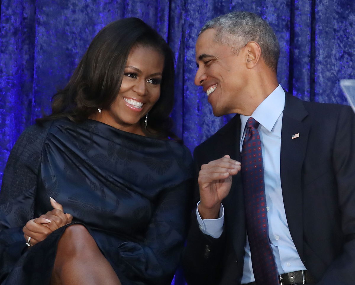 <i>Mark Wilson/Getty Images</i><br/>Former U.S. President Barack Obama and first lady Michelle Obama participate in the unveiling of their official portraits during a ceremony at the Smithsonian's National Portrait Gallery