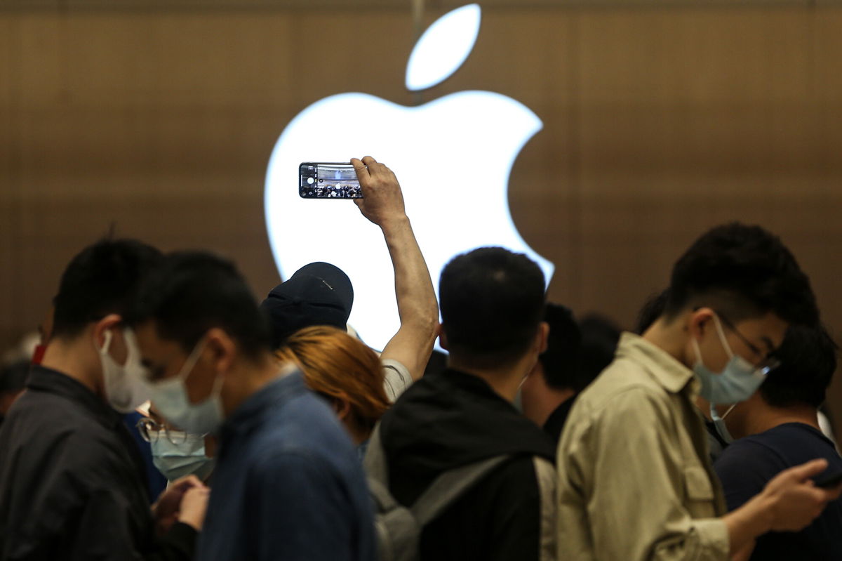 <i>Visual China Group/Getty Images</i><br/>Customers line up to enter a new Apple store on May 21 in Wuhan