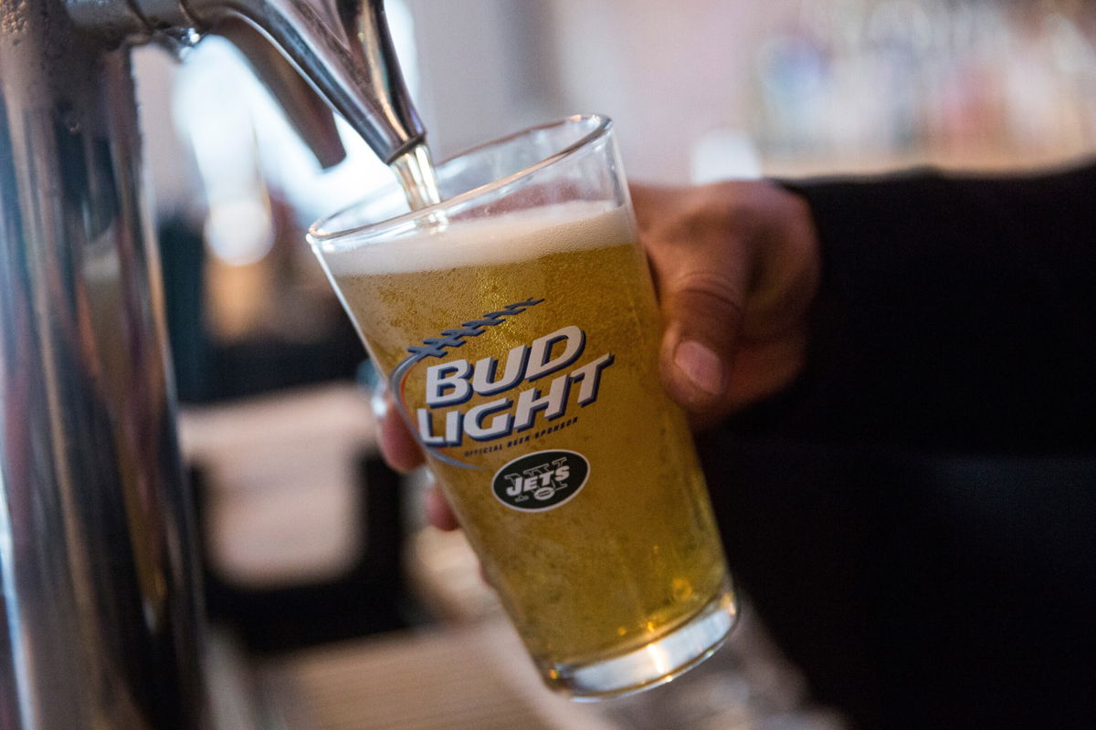 <i>Andrew Burton/Getty Images</i><br/>A bud light beer is poured from the tap at a bar on October 9