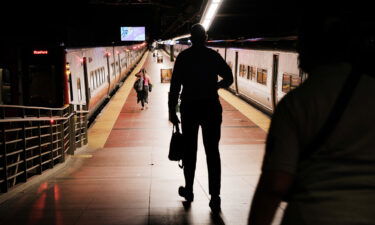 People walk to get a train in Grand Central Terminal in August 2021 in New York City. The economy is on shaky ground: stock markets have been selling off