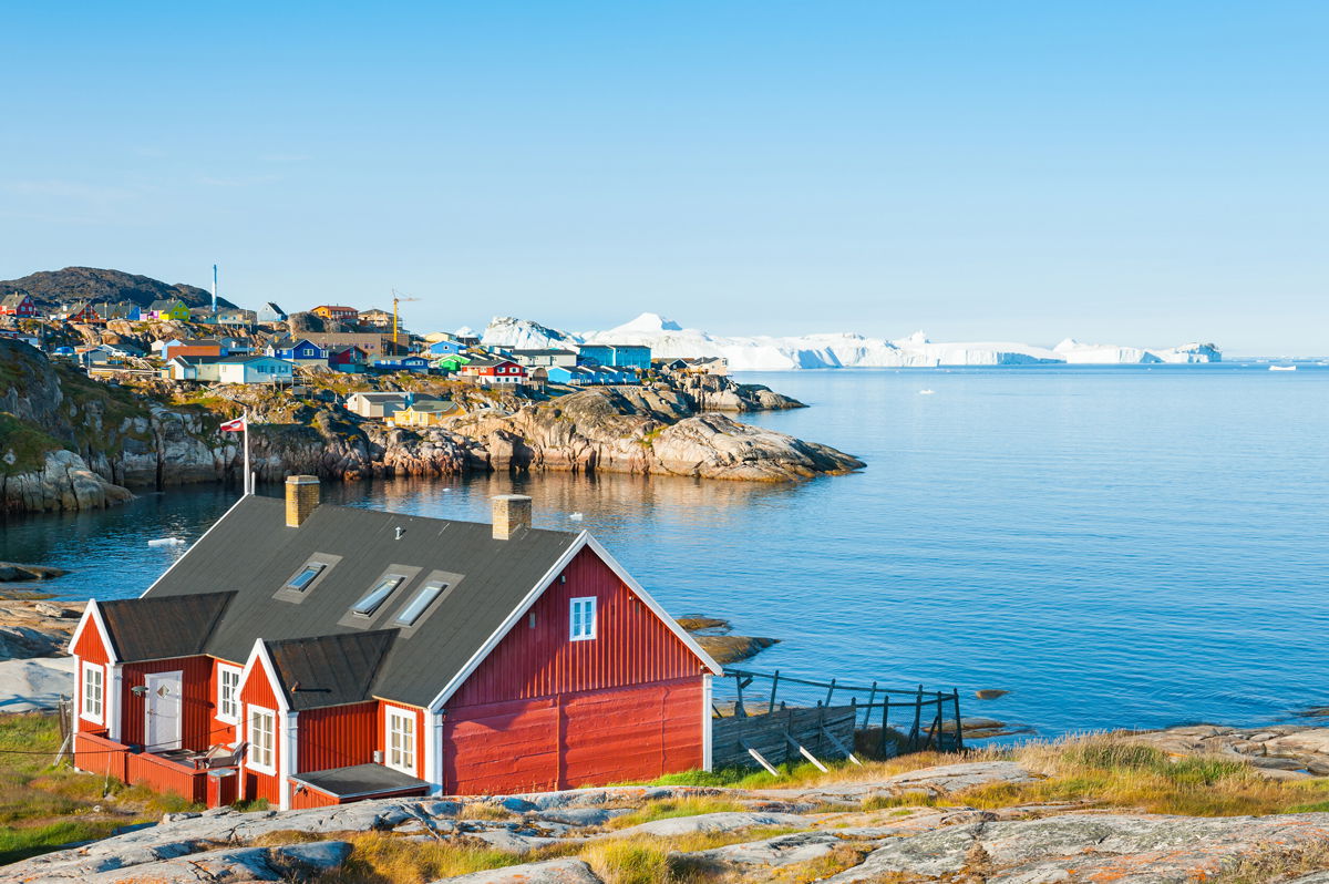 <i>Adobe Stock</i><br/>Colorful houses on the shore of Atlantic ocean in Ilulissat