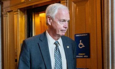 Sen. Ron Johnson walks to a weekly Republican luncheon on Capitol Hill on June 22 in Washington