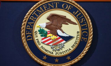 The Department of Justice seal is seen on a lectern in Washington