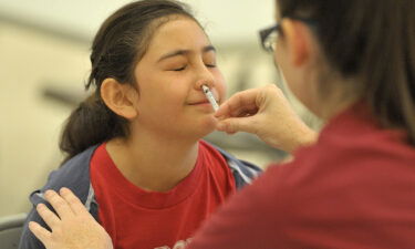 A student gets the FluMist vaccine