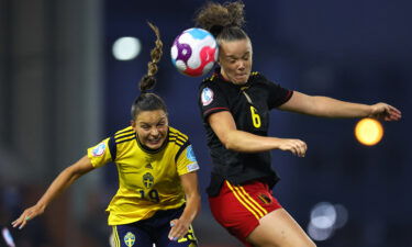 Sweden's Johanna Rytting Kaneryd (left) challenges for a header with Tine De Caigny of Belgium (right).