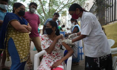 A health worker administers a Covid-19 vaccine in Hyderabad