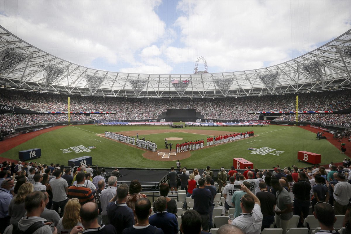 FILE - The New York Yankees, left, and the Boston Red Sox lineup for the national anthem before a baseball game in London on June 30, 2019. Major League Baseball plans to return to London next year for the first time since 2019. The league announced Thursday, Aug. 4, 2022, that the St. Louis Cardinals and Chicago Cubs will play a two-game series on June 24-25, 2023, at London Stadium. 