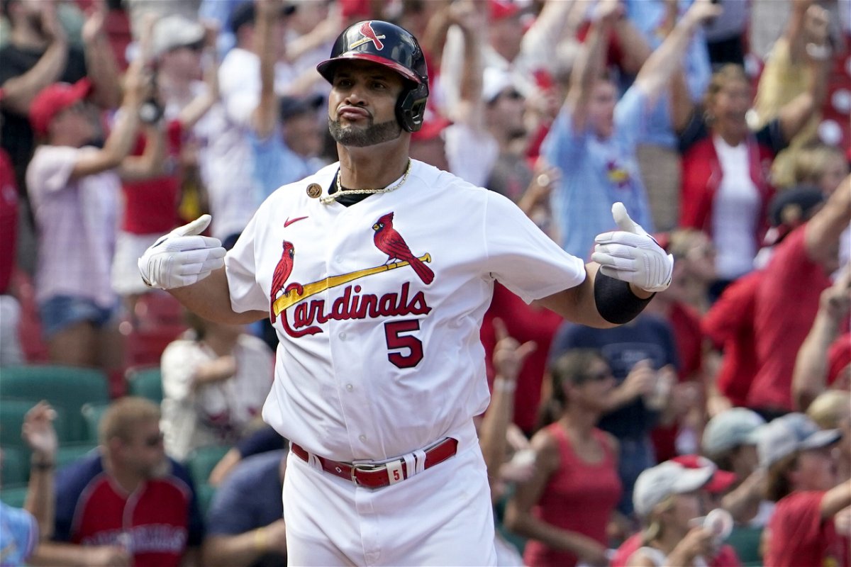 St. Louis Cardinals' Albert Pujols celebrates after hitting a three-run home run during the eighth inning of a baseball game against the Milwaukee Brewers Sunday, Aug. 14, 2022, in St. Louis. 