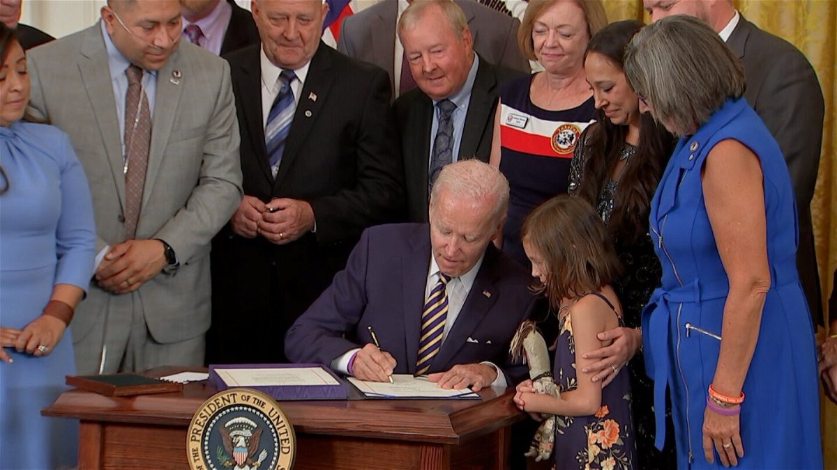 <i>POOL</i><br/>President Joe Biden signs the PACT Act into law at the White House on Wednesday - legislation aimed at expanding healthcare benefits for veterans and addressing exposure to toxic chemicals.
