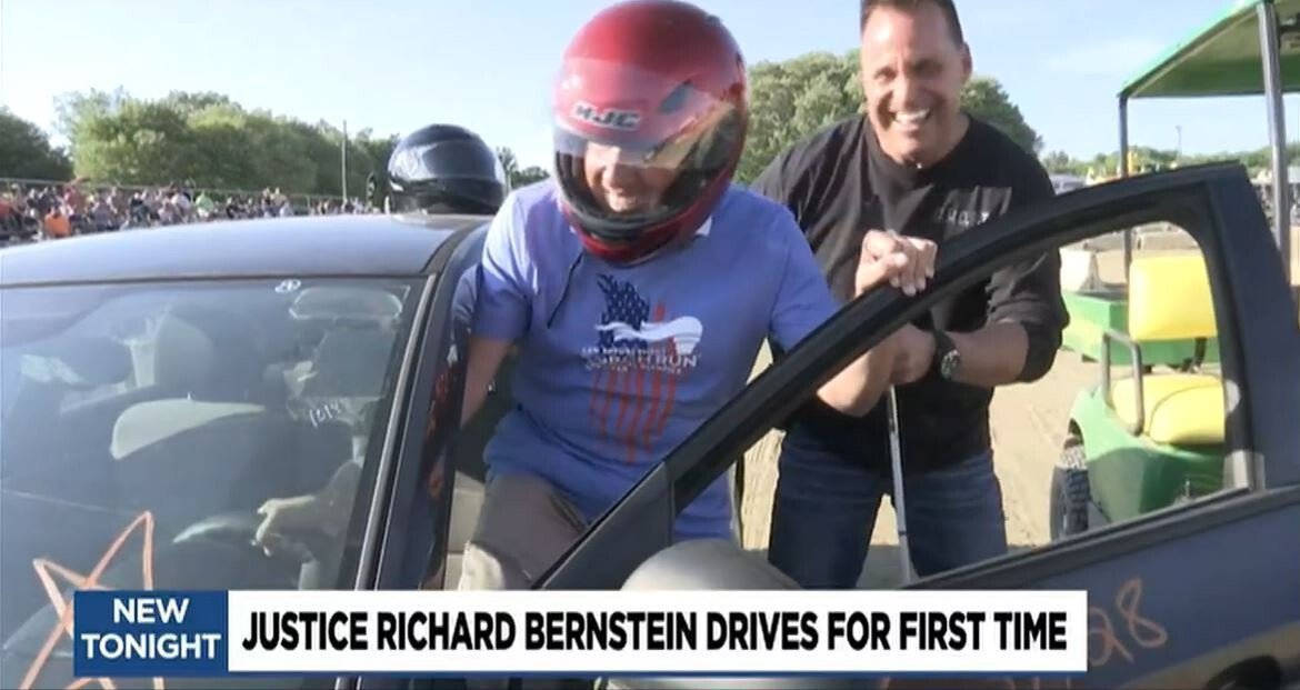 <i>WNEM</i><br/>Genesee County Sheriff Chris Swanson (R) helped Michigan Supreme Court Justice Richard Bernstein take a spin at the Genesee County Fairgrounds Tuesday