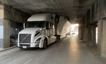 The Kansas City Police Department shared photos of a semi-truck that tried going under the overpass
