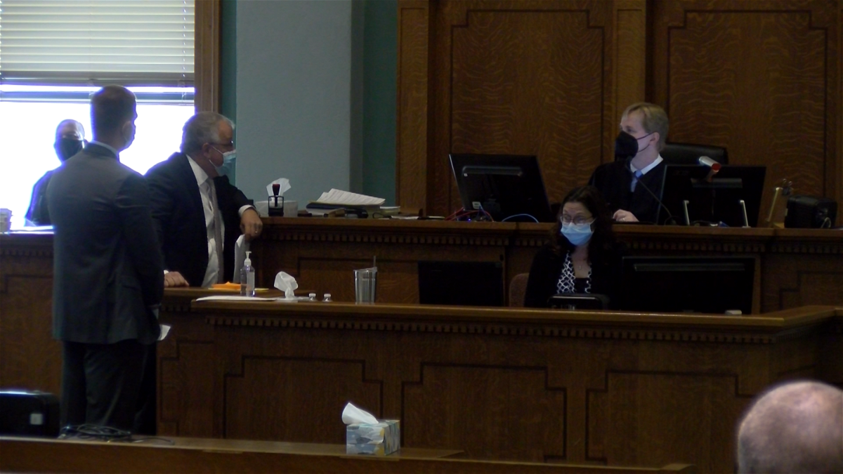 Boone County Judge Jeff Harris, defense attorney Brent Haden and University of Missouri lawyer Nicholas Beydler talk in a courtroom Monday, Aug. 22, 2022, about the Thomas Shultz case.