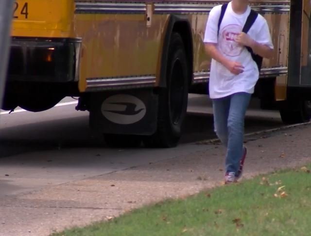 A student walks by a bus after the first day of classes at Jefferson Middle School in Columbia on Tuesday, Aug. 23, 2022.