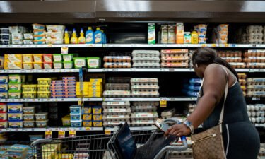 A customer shops for eggs in a Kroger grocery store on August 15 in Houston