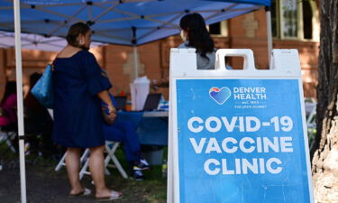 The US is on a Covid plateau. Pictured is a Covid-19 vaccine clinic in Denver