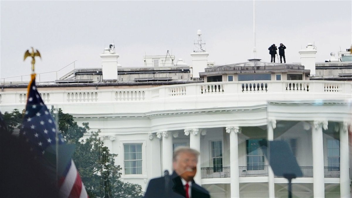 <i>Mandel Ngan/AFP via Getty Images</i><br/>Members of the Secret Service patrol from the roof of the White House as President Donald Trump speaks to supporters from The Ellipse on January 6