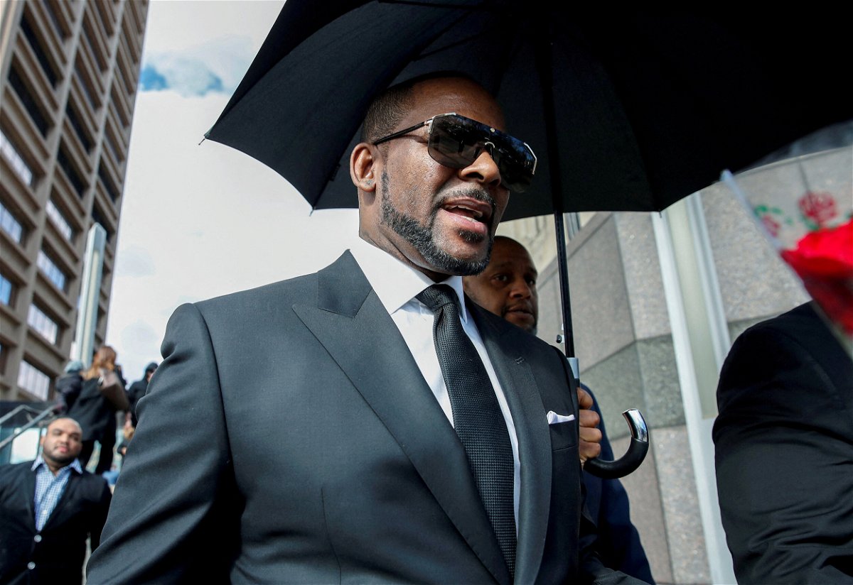 <i>Kamil Krzaczynski/Reuters/FILE</i><br/>Grammy-winning R&B star R. Kelly leaves the Cook County courthouse in March 2019 in Chicago. R. Kelly's federal trial in Chicago will revisit accusations made against the singer in 2008 that ended with his acquittal.