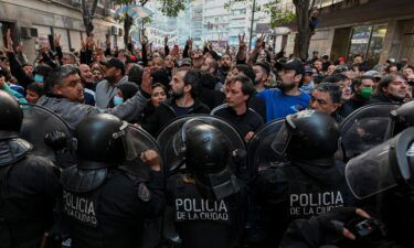 Supporters of Argentina's Vice President Cristina Fernandez de Kirchner clash with riot police during a demonstration near her home in Buenos Aires