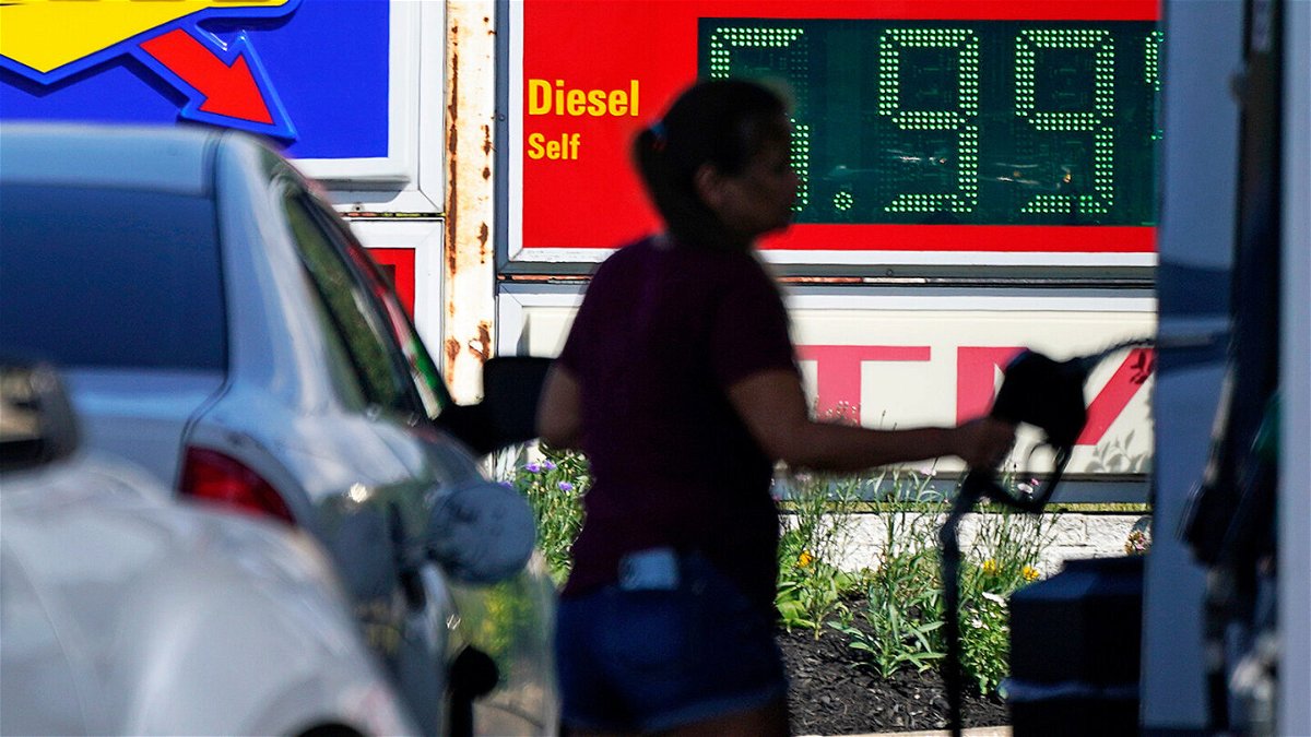 <i>Gene J. Puskar/AP/FILE</i><br/>Prices in the US stayed the same last month. A woman pumps gas at a Sunoco mini-mart in Independence