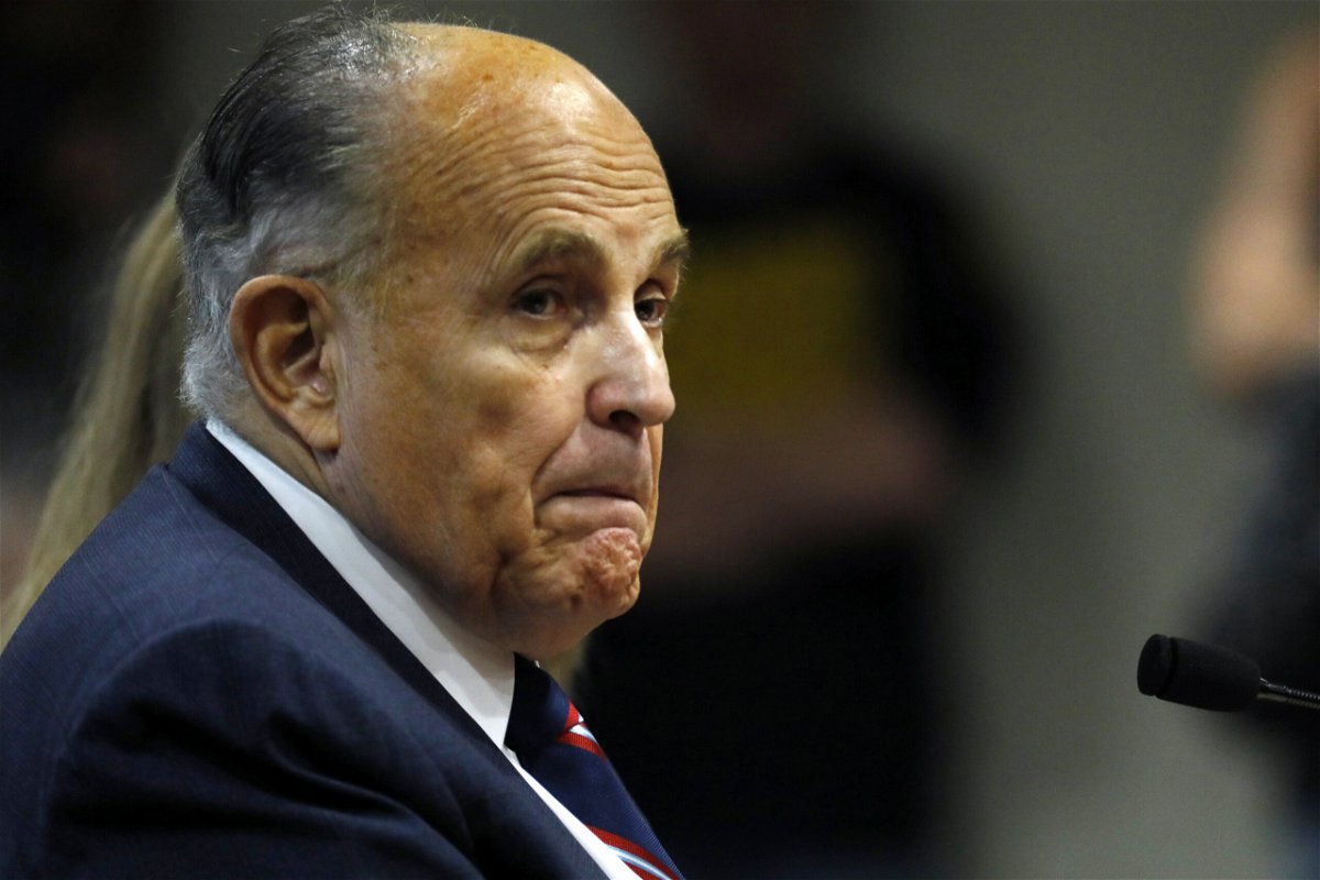 <i>Jeff Kowalsky/AFP/Getty Images</i><br/>Giuliani looks on during an appearance before the Michigan House Oversight Committee in Lansing