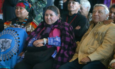 Littlefeather (seated center)