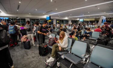 Travelers wait for their flight at Los Angeles International Airport. After two years of the pandemic