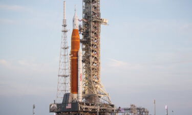 NASA's Space Launch System (SLS) rocket with the Orion spacecraft aboard is seen atop the mobile launcher as it is rolled up the ramp at Launch Pad 39B